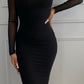 Robe noire manches. longues buste nu